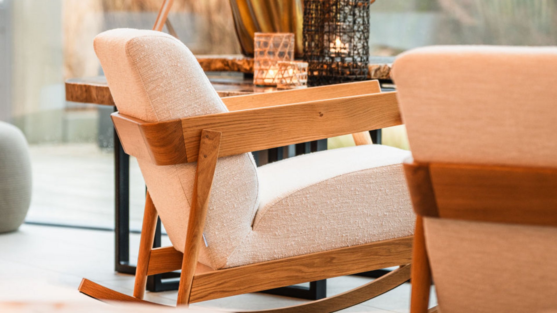 Modern wooden and fabric rocking chair in a bright living room